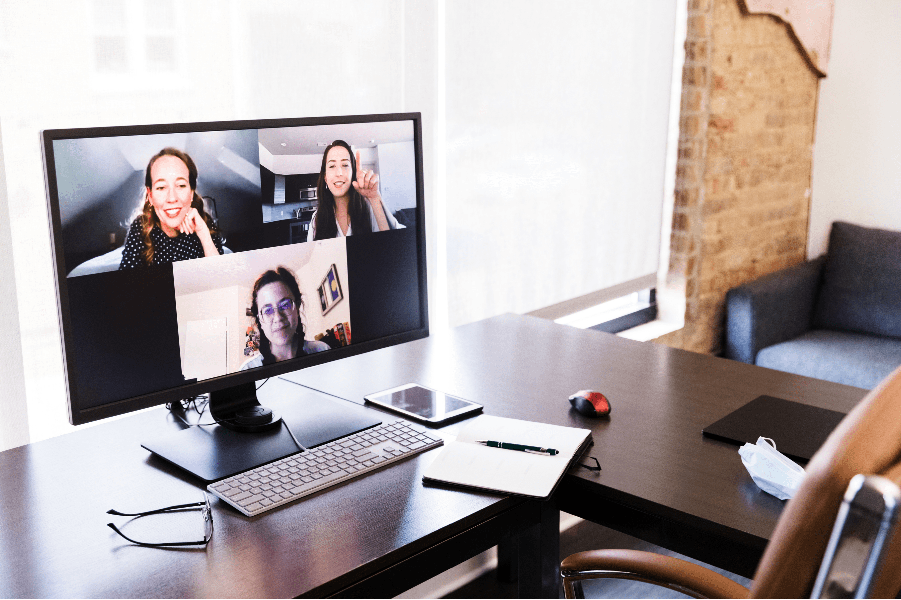 three women participating in a virtual meeting